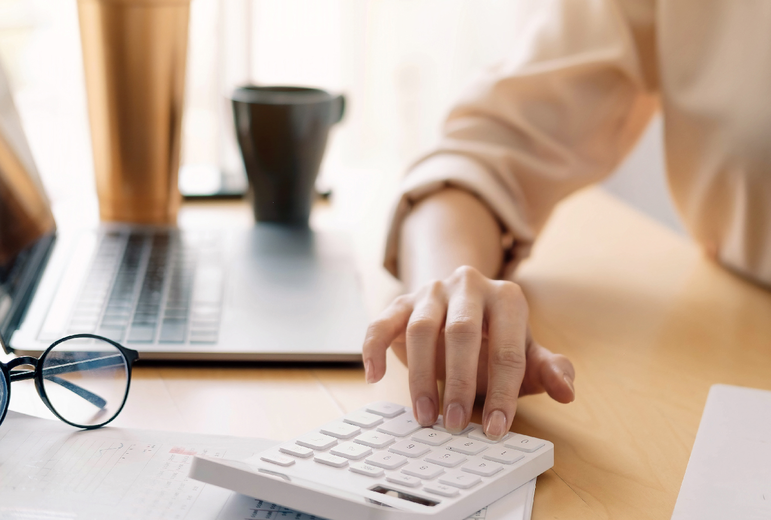 Woman using calculator